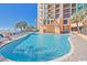 Large outdoor pool with plenty of lounge chairs and ocean views at 2710 N Ocean Blvd. # 308, Myrtle Beach, SC 29577