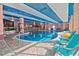 Unique indoor pool area with tropical design and blue lounge chairs at 2710 N Ocean Blvd. # 308, Myrtle Beach, SC 29577