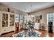 Cozy breakfast nook features a glass table, decorative rug and stylish accessories at 2749 Sanctuary Blvd., Conway, SC 29526