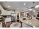 Bright kitchen showcasing an island with granite countertop, white cabinets, and modern appliances at 2749 Sanctuary Blvd., Conway, SC 29526