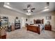 A generously-sized main bedroom features a wooden bed frame and ample natural light at 2749 Sanctuary Blvd., Conway, SC 29526