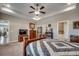 Spacious main bedroom boasts tray ceilings, ceiling fan, and ensuite bathroom at 2749 Sanctuary Blvd., Conway, SC 29526