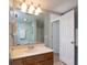 Well-lit bathroom featuring a single vanity, large mirror, and open doorway at 311 Cumberland Terrace Dr. # 7-E, Myrtle Beach, SC 29572