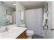 Bathroom featuring a single sink vanity, toilet, and shower with a patterned curtain at 311 Cumberland Terrace Dr. # 7-E, Myrtle Beach, SC 29572