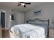 Brightly lit bedroom featuring a queen bed with blue accents and a large window at 311 Cumberland Terrace Dr. # 7-E, Myrtle Beach, SC 29572