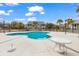 Community pool with nearby condos, palm trees, and outdoor seating at 311 Cumberland Terrace Dr. # 7-E, Myrtle Beach, SC 29572