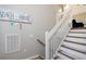 Bright staircase leading up with carpeted steps and a decorative sign at 311 Cumberland Terrace Dr. # 7-E, Myrtle Beach, SC 29572