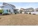 Backyard with a pergola, screen porch, seating, and a white fence at 313 Foxpath Loop, Myrtle Beach, SC 29588