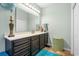 Bathroom view featuring vanity, storage cabinets, large mirror, and decorative accents at 313 Foxpath Loop, Myrtle Beach, SC 29588