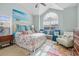 Bright bedroom with vaulted ceilings, a large window, and charming coastal decor at 313 Foxpath Loop, Myrtle Beach, SC 29588