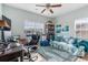 Comfortable bedroom with a ceiling fan, large window, and coastal-themed decor at 313 Foxpath Loop, Myrtle Beach, SC 29588