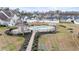 Aerial view of the community pool area with lounge chairs and well-kept landscaping at 313 Foxpath Loop, Myrtle Beach, SC 29588