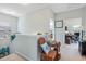 Hallway with coastal decor leading to a bedroom and office space at 313 Foxpath Loop, Myrtle Beach, SC 29588