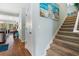 Hallway with stairs and beach-themed art on the wall at 313 Foxpath Loop, Myrtle Beach, SC 29588