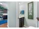 Hallway shot provides view of the kitchen and entry to a half bathroom with decorative details at 313 Foxpath Loop, Myrtle Beach, SC 29588