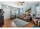 Cozy living room featuring a large window and comfortable leather furniture and hardwood floors at 313 Foxpath Loop, Myrtle Beach, SC 29588