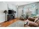 Inviting living room with a cozy fireplace, comfortable seating, and hardwood flooring at 313 Foxpath Loop, Myrtle Beach, SC 29588