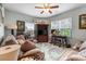 Cozy living room featuring comfortable seating, coastal accents, and a ceiling fan at 313 Foxpath Loop, Myrtle Beach, SC 29588