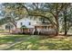 Charming two-story home featuring a brick foundation and a welcoming front porch at 315 Oak Dr. N, Surfside Beach, SC 29575