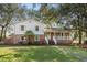 Charming two-story home featuring a brick foundation and a welcoming front porch at 315 Oak Dr. N, Surfside Beach, SC 29575