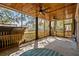 Covered screened porch with wood ceiling, ceiling fans, and view of backyard at 315 Oak Dr. N, Surfside Beach, SC 29575