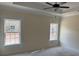Bright bedroom with large windows and modern ceiling fan at 3186 Wayside Rd., Conway, SC 29527