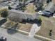 Aerial view of a single-Gathering home with a long driveway, mature trees, and fenced backyard at 3727 Otter St., Myrtle Beach, SC 29577