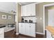 Bar area with white cabinets, black countertop, and convenient appliances at 3727 Otter St., Myrtle Beach, SC 29577