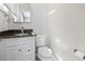 Half-bath featuring granite countertops, modern vanity, and updated fixtures at 3727 Otter St., Myrtle Beach, SC 29577