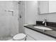 Updated bathroom featuring granite countertop, brushed silver fixtures, and tiled walk-in shower at 3727 Otter St., Myrtle Beach, SC 29577