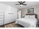 Bedroom featuring hardwood floors, wood accent wall, and ladder at 3727 Otter St., Myrtle Beach, SC 29577