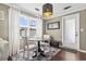 Cozy dining area with round table, chairs, and natural light from a window at 3727 Otter St., Myrtle Beach, SC 29577