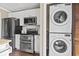 Kitchen features white cabinets, stainless steel appliances and stacked washer and dryer at 3727 Otter St., Myrtle Beach, SC 29577