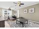 Stylish seating area featuring hardwood floors and a unique decorative accent wall at 3727 Otter St., Myrtle Beach, SC 29577