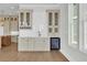 Wet bar featuring wine storage, custom cabinets and a sink, perfect for entertaining at 373 St. Julian Ln., Myrtle Beach, SC 29579