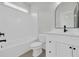 Modern white bathroom with subway tile surround tub and sleek black fixtures at 373 St. Julian Ln., Myrtle Beach, SC 29579