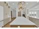 Bright, open kitchen featuring an oversized marble island, custom cabinetry, and modern light fixtures at 373 St. Julian Ln., Myrtle Beach, SC 29579