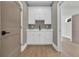 Well-lit laundry room with white cabinets, countertops and a modern sink at 373 St. Julian Ln., Myrtle Beach, SC 29579