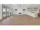 Bright open-concept living space with hardwood floors, access to outdoor balconies and a modern fireplace at 373 St. Julian Ln., Myrtle Beach, SC 29579