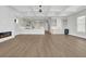 Open-concept living area with bar, drink fridge, hard wood floors, recessed lighting and modern fireplace at 373 St. Julian Ln., Myrtle Beach, SC 29579