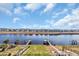 Beautiful aerial view of a backyard with two docks on the waterfront, a firepit, and houses in the background at 373 St. Julian Ln., Myrtle Beach, SC 29579