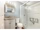 Bathroom featuring a white sink vanity and a walk-in shower with a fold down seat and sliding glass door at 3792 Hitchcock Way # 213, Myrtle Beach, SC 29577