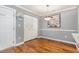 Dining area featuring hardwood floors, modern light fixture, and closet for storage at 3792 Hitchcock Way # 213, Myrtle Beach, SC 29577