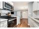 Well-lit kitchen features modern appliances, granite countertops, and subway tile backsplash at 3792 Hitchcock Way # 213, Myrtle Beach, SC 29577