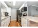 Well-equipped kitchen featuring stainless steel appliances, white cabinetry, and granite countertops at 3792 Hitchcock Way # 213, Myrtle Beach, SC 29577