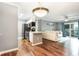 Modern kitchen with stainless steel appliances flowing into comfortable living area and balcony at 3792 Hitchcock Way # 213, Myrtle Beach, SC 29577