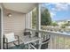 Outdoor patio with furniture and a view of the pond and nearby apartment buildings at 3792 Hitchcock Way # 213, Myrtle Beach, SC 29577