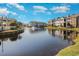 Scenic view of pond with a fountain and surrounding apartment buildings on a sunny day at 3792 Hitchcock Way # 213, Myrtle Beach, SC 29577