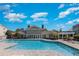 Resort-style swimming pool with spacious sundeck and comfortable lounge chairs under a bright blue sky at 3792 Hitchcock Way # 213, Myrtle Beach, SC 29577