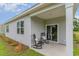 Cozy back porch with two rocking chairs and sliding glass door entrance into the house at 430 Acosta Circle, Conway, SC 29527